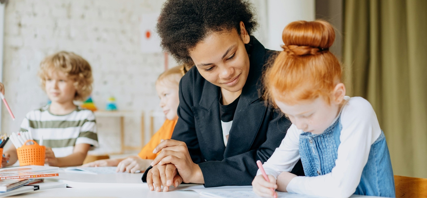 Teacher helping student