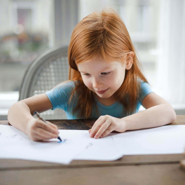 little girl writing