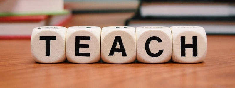 The word teach on dice
