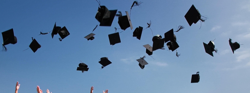 graduation hats in the air